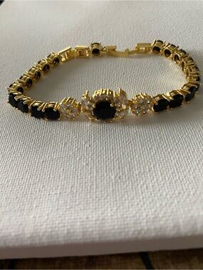 Gold-tone Tennis Bracelet with Black and Clear Gemstones